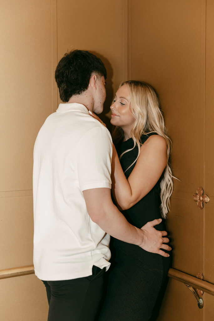 Salt Lake engagement photography close-up inside gold elevator at Capitol