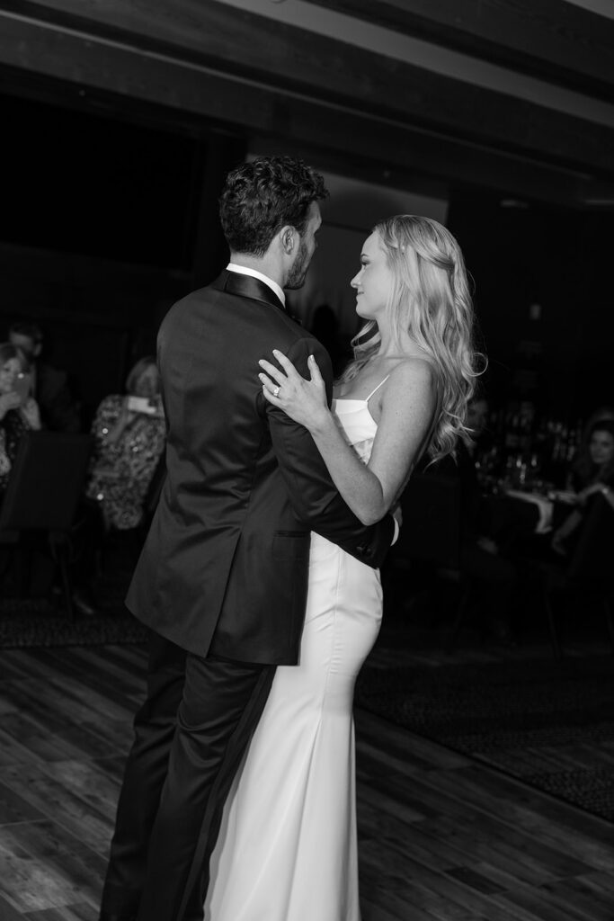Bride and groom share a romantic first dance at their Jackson Hole Cloudveil wedding reception