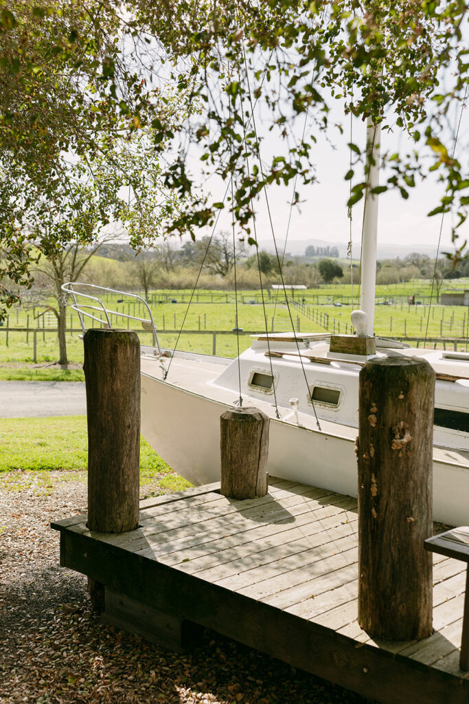 A docked sailboat on the venue’s property adds rustic charm to this Sonoma County destination wedding location