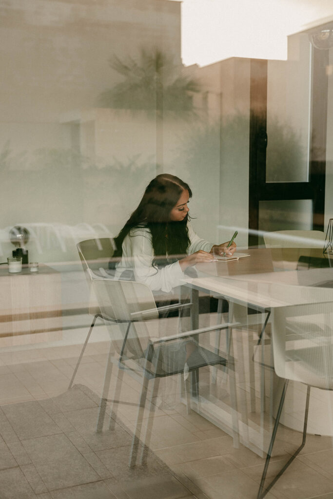 Bride writes personal vows in a quiet morning moment before their ceremony
