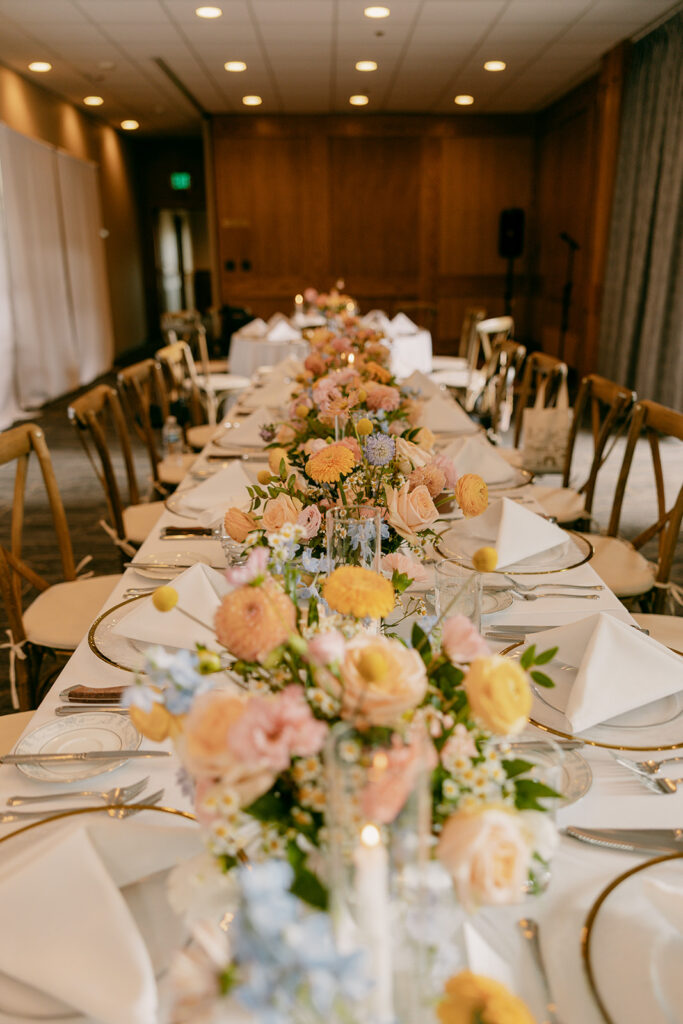 Jackson Lake Lodge wedding reception banquet table with vibrant florals